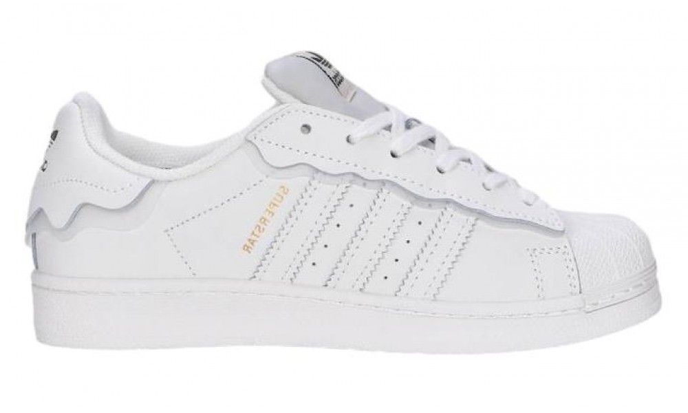 All white store low top adidas